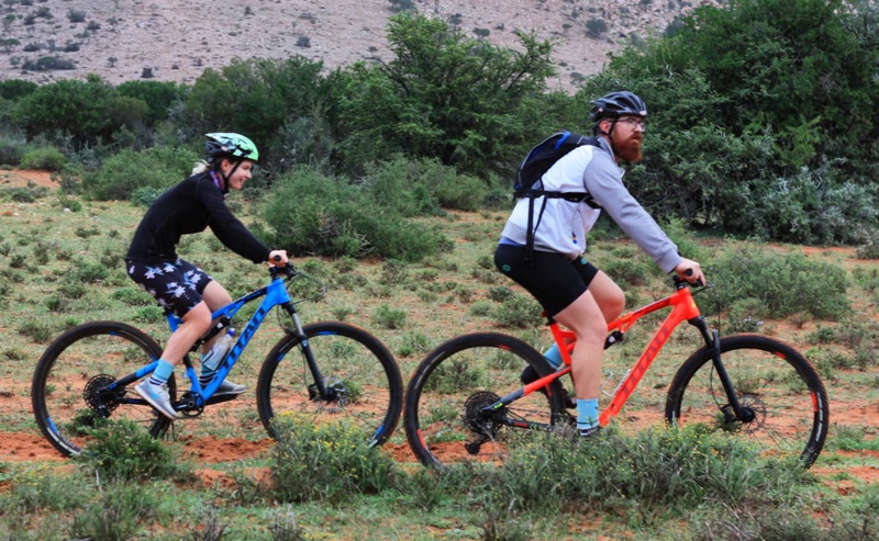 A man and a woman Mountain Biking in the Karoo.